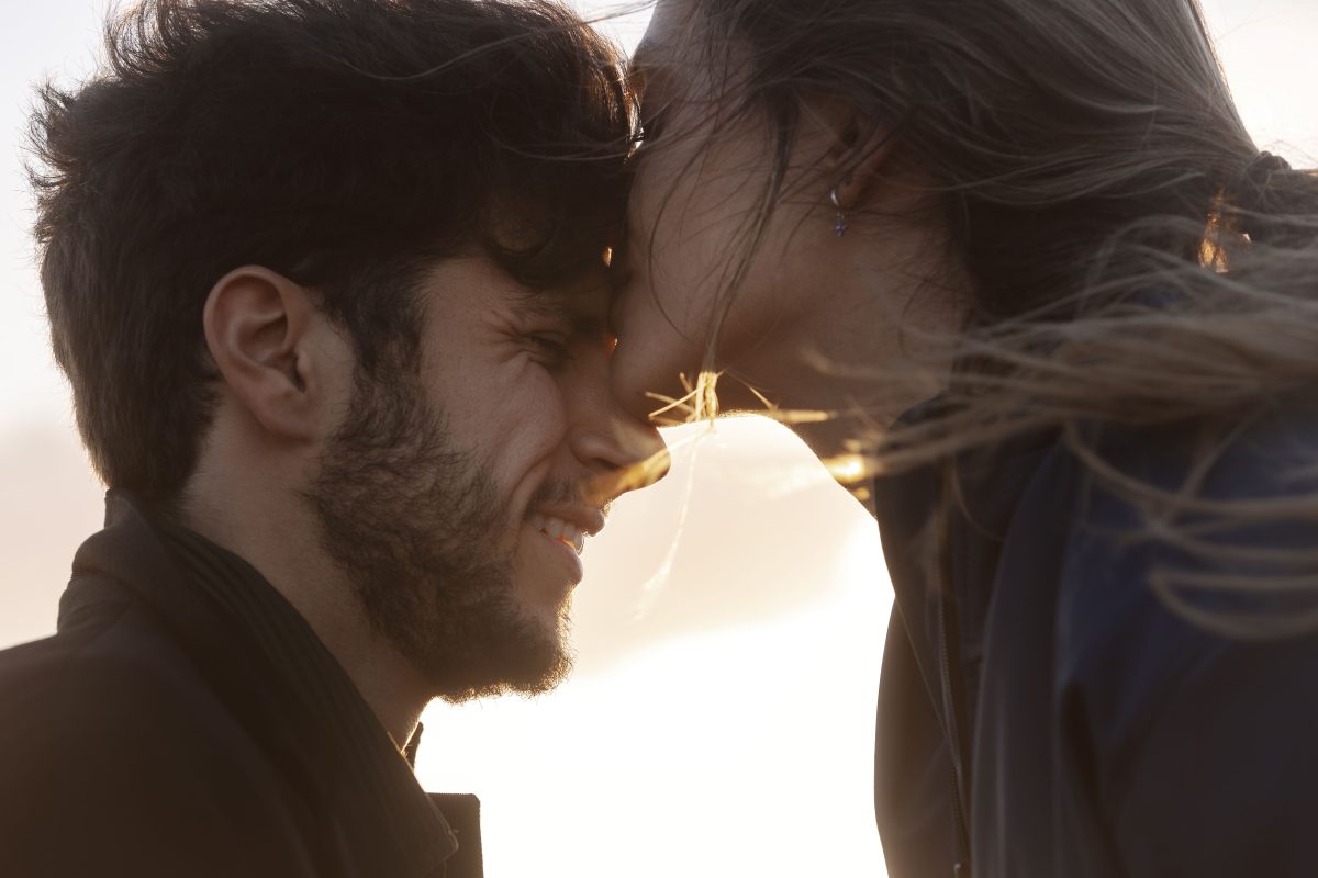 Side-view-woman-kissing-man-forehead
